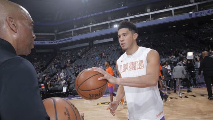 SACRAMENTO, CA - MARCH 23: Devin Booker #1 of the Phoenix Suns inspects a basketball prior to the game against the Sacramento Kings on March 23, 2019 at Golden 1 Center in Sacramento, California. NOTE TO USER: User expressly acknowledges and agrees that, by downloading and or using this photograph, User is consenting to the terms and conditions of the Getty Images Agreement. Mandatory Copyright Notice: Copyright 2019 NBAE (Photo by Rocky Widner/NBAE via Getty Images)