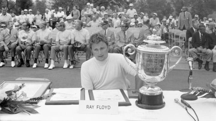 1969: Ray Floyd sits on a table next to the Annual Championship of the Professional Golfers Association of America, Rodman Wanamaker Trophy as he wins the 1969 PGA championship. (Photo by Martin Mills/Getty Images)
