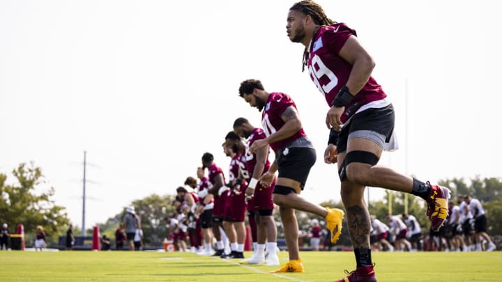 Jul 29, 2021; Richmond, VA, USA; Washington Football Team defensive ends Chase Young (99) and Montez Sweat (90) warm up with teammates during training camp at Bon Secours Washington Football Team Training Center. Mandatory Credit: Scott Taetsch-USA TODAY Sports