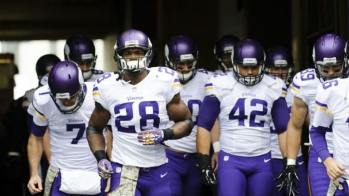 Nov 17, 2013; Seattle, WA, USA; Minnesota Vikings running back Adrian Peterson (28) leads teammates out of the tunnel during pre game warm ups prior to the game against the Seattle Seahawks at CenturyLink Field. Mandatory Credit: Steven Bisig-USA TODAY Sports