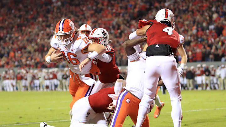 RALEIGH, NORTH CAROLINA – NOVEMBER 09: Trevor Lawrence #16 of the Clemson Tigers runs for a touchdown against the North Carolina State Wolfpack during their game at Carter-Finley Stadium on November 09, 2019 in Raleigh, North Carolina. (Photo by Streeter Lecka/Getty Images)