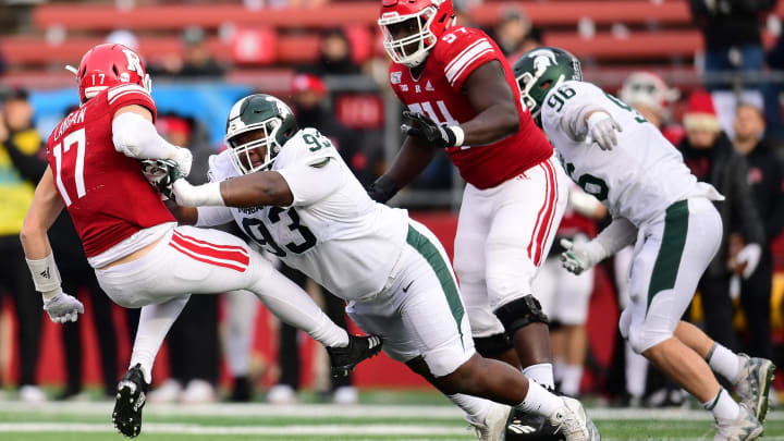 PISCATAWAY, NEW JERSEY – NOVEMBER 23: Naquan Jones #93 of the Michigan State Spartans shoves Johnny Langan #17 of the Rutgers Scarlet Knights to the ground during the second half of their game at SHI Stadium on November 23, 2019 in Piscataway, New Jersey. (Photo by Emilee Chinn/Getty Images)