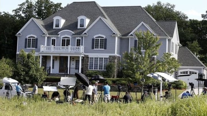 Jun 20, 2013; North Attleborough, MA, USA; Members of the media stake out the house of New England Patriots tight end Aaron Hernandez in North Attleborough, Mass. Mandatory Credit: Winslow Townson-USA TODAY Sports