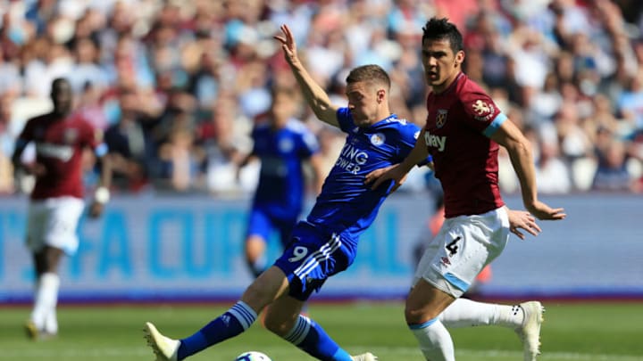 LONDON, ENGLAND - APRIL 20: Jamie Vardy of Leicester City is tackled by Fabian Balbuena of West Ham United during the Premier League match between West Ham United and Leicester City at London Stadium on April 20, 2019 in London, United Kingdom. (Photo by Stephen Pond/Getty Images)