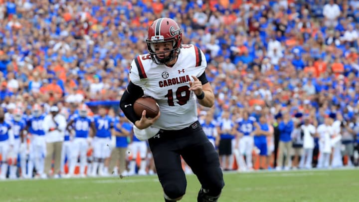 GAINESVILLE, FLORIDA - NOVEMBER 10: Jake Bentley #19 of the South Carolina Gamecocks rushes for yardage during the game against the Florida Gators at Ben Hill Griffin Stadium on November 10, 2018 in Gainesville, Florida. (Photo by Sam Greenwood/Getty Images)