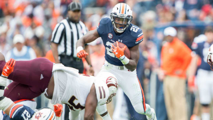 AUBURN, AL – NOVEMBER 18: Running back Kerryon Johnson #21 of the Auburn Tigers looks to maneuver by defensive lineman Donald Louis Jr. #58 of the Louisiana Monroe Warhawks at Jordan-Hare Stadium on November 18, 2017 in Auburn, Alabama. (Photo by Michael Chang/Getty Images)