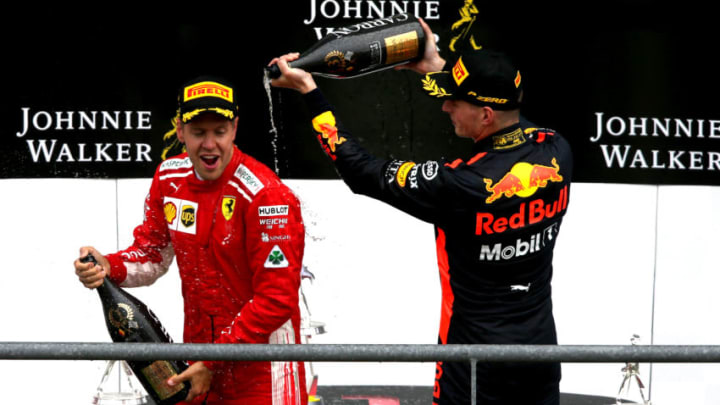 SPA, BELGIUM - AUGUST 26: Race winner Sebastian Vettel of Germany and Ferrari and third place finisher Max Verstappen of Netherlands and Red Bull Racing celebrate on the podium during the Formula One Grand Prix of Belgium at Circuit de Spa-Francorchamps on August 26, 2018 in Spa, Belgium. (Photo by Charles Coates/Getty Images)