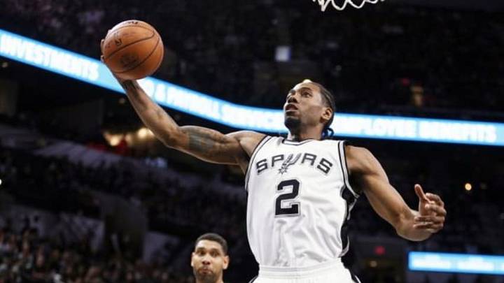 Dec 14, 2015; San Antonio, TX, USA; San Antonio Spurs small forward Kawhi Leonard (2) grabs a rebound during the first half against the Utah Jazz at AT&T Center. Mandatory Credit: Soobum Im-USA TODAY Sports