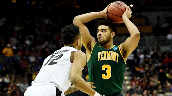 MILWAUKEE, WI - MARCH 16: Anthony Lamb #3 of the Vermont Catamounts handles the ball while being guarded by Vince Edwards #12 of the Purdue Boilermakers in the second half during the first round of the 2017 NCAA Men's Basketball Tournament at BMO Harris Bradley Center on March 16, 2017 in Milwaukee, Wisconsin. (Photo by Stacy Revere/Getty Images)