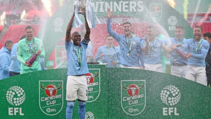 Manchester City's Brazilian midfielder Fernandinho lifts the winners trophy after the English League Cup final football match between Manchester City and Tottenham Hotspur at Wembley Stadium, northwest London on April 25, 2021. - Manchester City claimed a fourth consecutive League Cup on Sunday with a dominant display to beat Tottenham 1-0 in front of 8,000 fans at Wembley. - RESTRICTED TO EDITORIAL USE. No use with unauthorized audio, video, data, fixture lists, club/league logos or 'live' services. Online in-match use limited to 120 images. An additional 40 images may be used in extra time. No video emulation. Social media in-match use limited to 120 images. An additional 40 images may be used in extra time. No use in betting publications, games or single club/league/player publications. (Photo by CARL RECINE / POOL / AFP) / RESTRICTED TO EDITORIAL USE. No use with unauthorized audio, video, data, fixture lists, club/league logos or 'live' services. Online in-match use limited to 120 images. An additional 40 images may be used in extra time. No video emulation. Social media in-match use limited to 120 images. An additional 40 images may be used in extra time. No use in betting publications, games or single club/league/player publications. / RESTRICTED TO EDITORIAL USE. No use with unauthorized audio, video, data, fixture lists, club/league logos or 'live' services. Online in-match use limited to 120 images. An additional 40 images may be used in extra time. No video emulation. Social media in-match use limited to 120 images. An additional 40 images may be used in extra time. No use in betting publications, games or single club/league/player publications. (Photo by CARL RECINE/POOL/AFP via Getty Images)