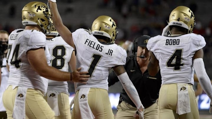 Nov 12, 2016; Tucson, AZ, USA; Colorado Buffaloes center Alex Kelley (74) (left) wide receiver Shay Fields (1) and wide receiver Bryce Bobo (4) celebrate after scoring a touchdown against the Arizona Wildcats during the third quarter at Arizona Stadium. Colorado won 49-24. Mandatory Credit: Casey Sapio-USA TODAY Sports