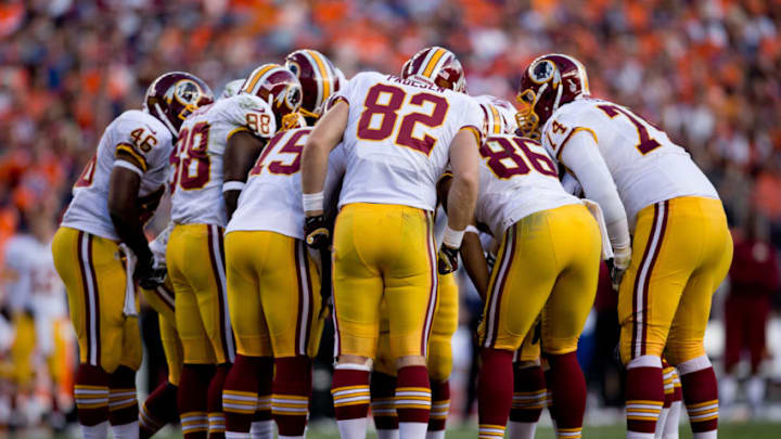 DENVER, CO - OCTOBER 27: The Washington Redskins huddle during a game against the Denver Broncos at Sports Authority Field Field at Mile High on October 27, 2013 in Denver, Colorado. The Broncos defeated the Redskins 45-21. (Photo by Justin Edmonds/Getty Images)