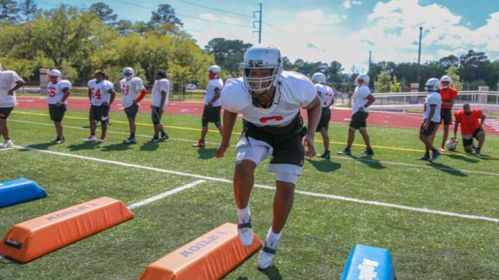 Jenkins High's Tavion Gadson runs drills during spring practice.