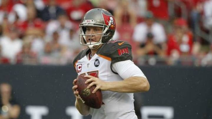 Sep 14, 2014; Tampa, FL, USA; Tampa Bay Buccaneers quarterback Josh McCown (12) gets pressured against the St. Louis Rams during the second quarter at Raymond James Stadium. Mandatory Credit: Kim Klement-USA TODAY Sports