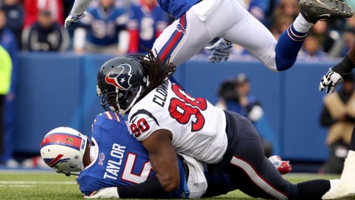 Dec 6, 2015; Orchard Park, NY, USA; Houston Texans outside linebacker Jadeveon Clowney (90) sacks Buffalo Bills quarterback Tyrod Taylor (5) during the second half at Ralph Wilson Stadium. Buffalo beats Houston 30 to 21. Mandatory Credit: Timothy T. Ludwig-USA TODAY Sports