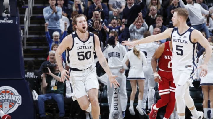 INDIANAPOLIS, IN - DECEMBER 15: Joey Brunk #50 and Paul Jorgensen #5 of the Butler Bulldogs celebrate against the Indiana Hoosiers in the second half of the Crossroads Classic at Bankers Life Fieldhouse on December 15, 2018 in Indianapolis, Indiana. Indiana won 71-68. (Photo by Joe Robbins/Getty Images)