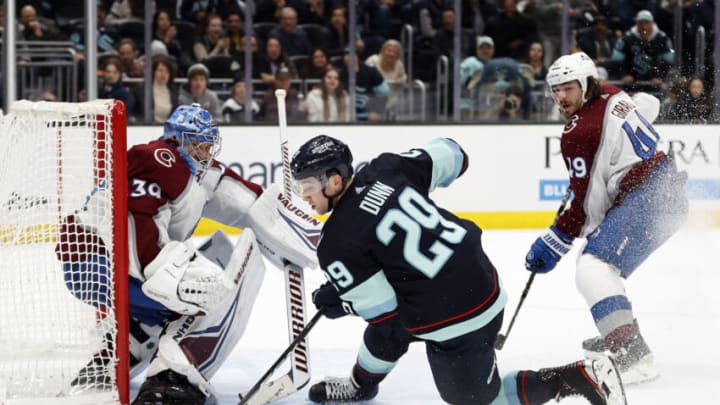 SEATTLE, WASHINGTON - JANUARY 21: Vince Dunn #29 of the Seattle Kraken attempts a shot against Pavel Francouz #39 of the Colorado Avalanche in overtime at Climate Pledge Arena on January 21, 2023 in Seattle, Washington. (Photo by Steph Chambers/Getty Images)