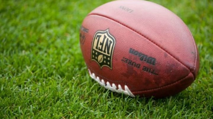 Aug 2, 2014; Detroit, MI, USA; A football rest on the field during training camp at the Detroit Lions training facility. Mandatory Credit: Tim Fuller-USA TODAY Sports Aug 2, 2014; Detroit, MI, USA; A football rest on the field during training camp at the Detroit Lions training facility. Mandatory Credit: Tim Fuller-USA TODAY Sports