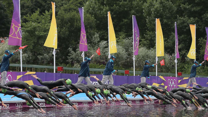 LONDON, GB - AUGUST 4: Fifty-six women start the race with a dive into the Serpentine River during the women's triathlon at the London 2012 Olympic Games at the Hyde Park. (Steve Russell/Toronto Star via Getty Images)