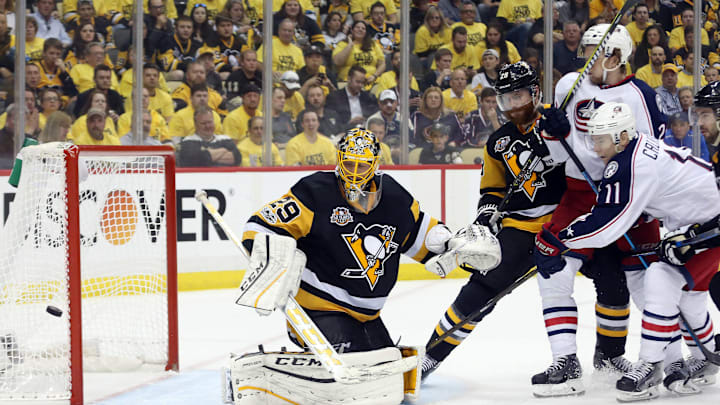 Apr 20, 2017; Pittsburgh, PA, USA; Columbus Blue Jackets left wing Matt Calvert (11) shoots the puck wide of Pittsburgh Penguins goalie Marc-Andre Fleury (29) during the third period in game five of the first round of the 2017 Stanley Cup Playoffs at PPG PAINTS Arena. The Pens won the game 5-2 and the series 4 games to 1. Mandatory Credit: Charles LeClaire-USA TODAY Sports