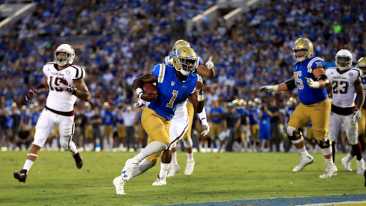 PASADENA, CA - SEPTEMBER 03: Soso Jamabo #1 of the UCLA Bruins rushes for a touchdown as Anthony Hines III #19 of the Texas A&M Aggies defends during the second half of a game at the Rose Bowl on September 3, 2017 in Pasadena, California. (Photo by Sean M. Haffey/Getty Images)