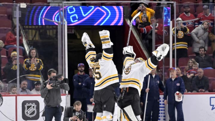 Jan 24, 2023; Montreal, Quebec, CAN; Boston Bruins goalie Linus Ullmark (35) and teammate goalie Jeremy Swayman (1) celebrate the win over The Montreal Canadiens at the Bell Centre. Mandatory Credit: Eric Bolte-USA TODAY Sport