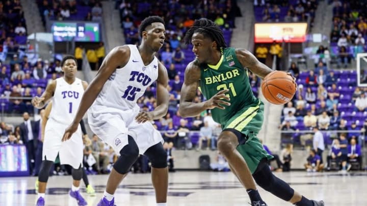 Feb 27, 2016; Fort Worth, TX, USA; Baylor Bears forward Taurean Prince (21) drives to the basket as TCU Horned Frogs forward JD Miller (15) defends during the second half at Ed and Rae Schollmaier Arena. Mandatory Credit: Kevin Jairaj-USA TODAY Sports