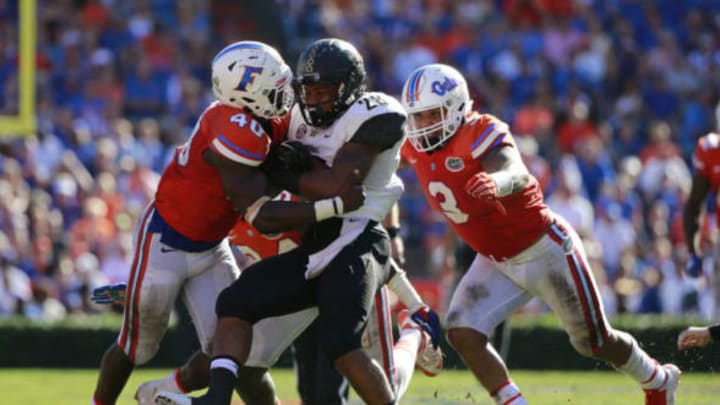 Nov 7, 2015; Gainesville, FL, USA; Florida Gators linebacker Jarrad Davis (40) and linebacker Antonio Morrison (3) tackle Vanderbilt Commodores running back Dallas Rivers (28) during the second half at Ben Hill Griffin Stadium. Florida Gators defeated the Vanderbilt Commodores 9-7. Mandatory Credit: Kim Klement-USA TODAY Sports