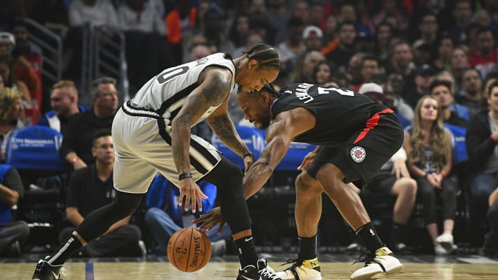 LOS ANGELES, CA – OCTOBER 31: San Antonio Spurs forward DeMar DeRozan (10) and Los Angeles Clippers forward Kawhi Leonard (2) fight for a loose ball during an NBA game between the San Antonio Spurs and the LA Clippers on October 31, 2019, at STAPLES Center in Los Angeles, CA. (Photo by Brian Rothmuller/Icon Sportswire via Getty Images)