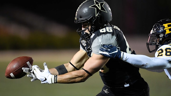 Vanderbilt tight end Ben Bresnahan (86) drops a pass as he is defended by ETSU defensive back Artevius Smith (26) during the fourth quarter at Vanderbilt Stadium Saturday, Nov. 23, 2019 in Nashville, Tenn.Nas Vandy Etsu 035