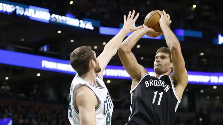 Apr 10, 2017; Boston, MA, USA; Brooklyn Nets center Brook Lopez (11) puts up a shot while guarded by Boston Celtics center Tyler Zeller (44) during the third quarter at TD Garden. The Celtics won 114-105. Mandatory Credit: Greg M. Cooper-USA TODAY Sports