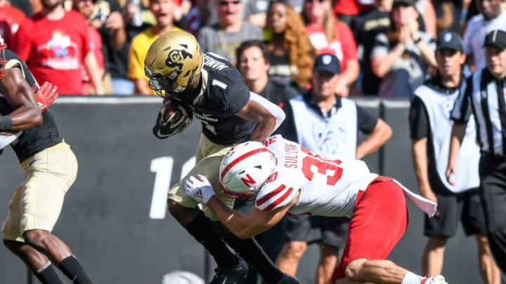 BOULDER, CO - SEPTEMBER 7: Running back Jaren Mangham #1 of the Colorado Buffaloes is hit by safety Eli Sullivan #30 of the Nebraska Cornhuskers in the third quarter of a game at Folsom Field on September 7, 2019 in Boulder, Colorado. (Photo by Dustin Bradford/Getty Images)