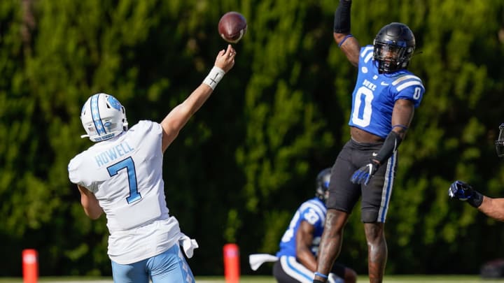Nov 7, 2020; Durham, North Carolina, USA; Duke Blue Devils safety Marquis Waters (0) goes up for a block on a pass by North Carolina Tar Heels quarterback Sam Howell (7)during the second quarter at Wallace Wade Stadium. Mandatory Credit: Jim Dedmon-USA TODAY Sports
