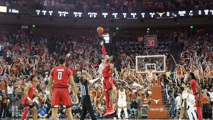 Feb 19, 2022; Austin, Texas, USA; Texas Tech Red Raiders forward Bryson Williams (11) and Texas Longhorns forward Christian Bishop (32) in jump ball to start the game at Frank C. Erwin Jr. Center. Mandatory Credit: Scott Wachter-USA TODAY Sports