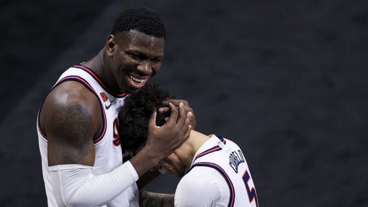 Mar 13, 2021; Indianapolis, Indiana, USA; Illinois Fighting Illini center Kofi Cockburn (21) and guard Andre Curbelo (5) celebrate defeating the Iowa Hawkeyes at Lucas Oil Stadium. Mandatory Credit: Aaron Doster-USA TODAY Sports