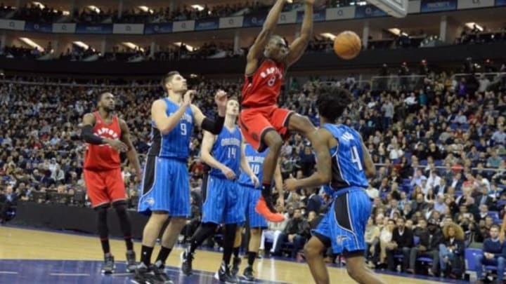 Jan 14, 2016; London, United Kingdom; Toronto Raptors center Bismack Biyombo (8) dunks against the Orlando Magic during the NBA Global Games at The O2 Arena. Raptors won the games 106-103 in overtime. Mandatory Credit: Leo Mason-USA TODAY Sports