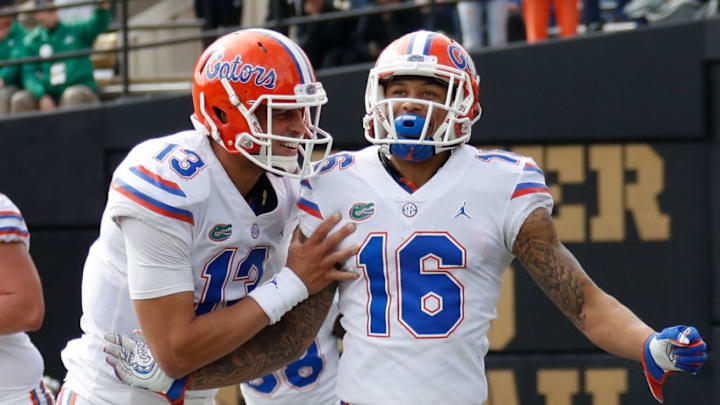 NASHVILLE, TN - OCTOBER 13: Quarterback Feleipe Franks #13 of the Florida Gators congratulates teammate Freddie Swain #16 after scoring a touchdown against the Vanderbilt Commodores during the second half at Vanderbilt Stadium on October 13, 2018 in Nashville, Tennessee. (Photo by Frederick Breedon/Getty Images) NASHVILLE, TN - OCTOBER 13: Quarterback Feleipe Franks #13 of the Florida Gators congratulates teammate Freddie Swain #16 after scoring a touchdown against the Vanderbilt Commodores during the second half at Vanderbilt Stadium on October 13, 2018 in Nashville, Tennessee. (Photo by Frederick Breedon/Getty Images)