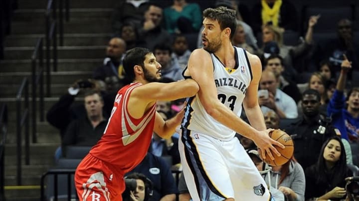 Oct 25, 2013; Memphis, TN, USA; Memphis Grizzlies center Marc Gasol (33) posts up against Houston Rockets small forward Omri Casspi (18) during the third quarter at FedExForum. Memphis Grizzlies lose to Houston Rockets 92 - 73. Mandatory Credit: Justin Ford-USA TODAY Sports