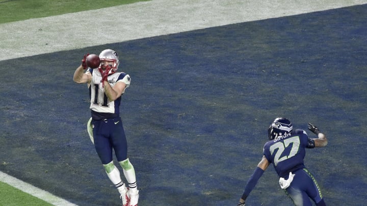 GLENDALE, AZ – FEBRUARY 01 : Julian Edelman #11 of the New England Patriots catches a touchdown pass over Tharold Simon #27 of the Seattle Seahawks in Super Bowl XLIX February 1, 2015 at the University of Phoenix Stadium in Glendale, Arizona. The Patriots won the game 28-24. (Photo by Focus on Sport/Getty Images)