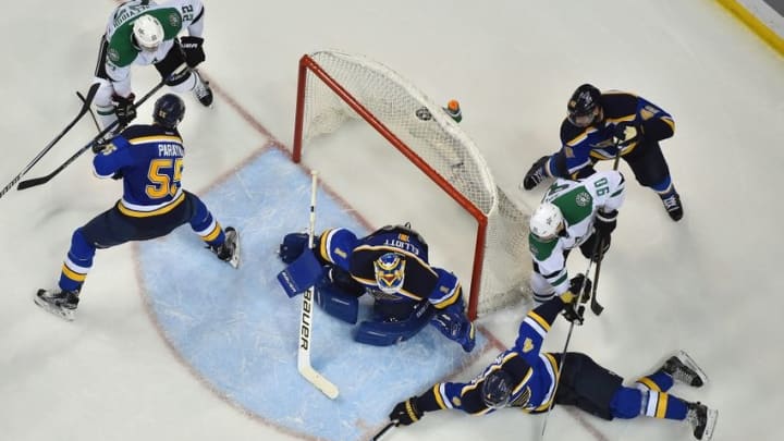 May 3, 2016; St. Louis, MO, USA; St. Louis Blues defenseman Carl Gunnarsson (4) reaches to block the puck against the Dallas Stars during the second period in game three of the second round of the 2016 Stanley Cup Playoffs at Scottrade Center. Mandatory Credit: Jasen Vinlove-USA TODAY Sports