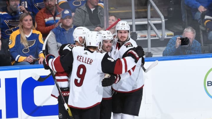 ST. LOUIS, MO - NOVEMBER 12: Conor Garland #83 of the Arizona Coyotes is congratulated by teammates after scoring a goal against the St. Louis Blues at Enterprise Center on November 12, 2019 in St. Louis, Missouri. (Photo by Joe Puetz/NHLI via Getty Images)
