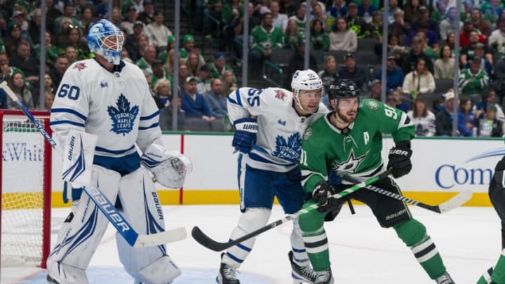 Oct 26, 2023; Dallas, Texas, USA; Dallas Stars center Tyler Seguin (91) and Toronto Maple Leafs defenseman Mark Giordano (55) battle for position in front of goaltender Joseph Woll (60) during the second period at the American Airlines Center. Mandatory Credit: Jerome Miron-USA TODAY Sports