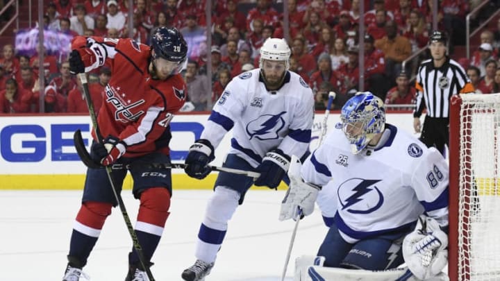 WASHINGTON, DC – MAY 15: Lars Eller #20 of the Washington Capitals and Dan Girardi #5 of the Tampa Bay Lightning battle for the puck in front of Andrei Vasilevskiy #88 in the first period in Game Three of the Eastern Conference Final during the 2018 NHL Stanley Cup Playoffs at Capital One Arena on May 15, 2018 in Washington, DC. (Photo by Patrick McDermott/NHLI via Getty Images)