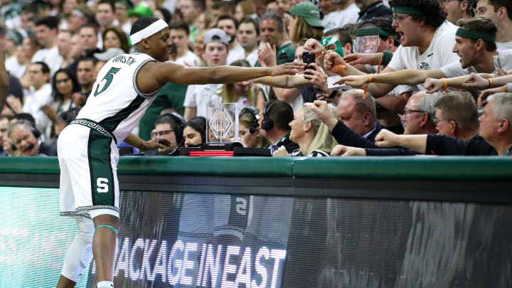 EAST LANSING, MICHIGAN – MARCH 08: Cassius Winston #5 of the Michigan State Spartans high fives fans prior to playing the Ohio State Buckeyes at the Breslin Center on March 08, 2020 in East Lansing, Michigan. (Photo by Gregory Shamus/Getty Images)