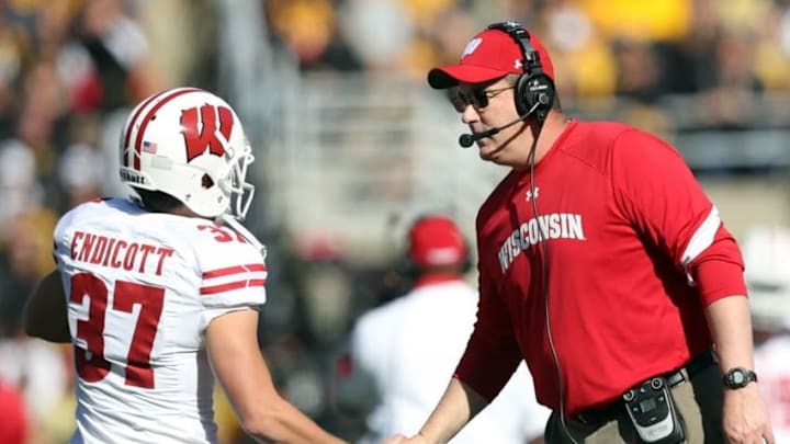 Oct 22, 2016; Iowa City, IA, USA; Wisconsin Badgers head coach Paul Chryst shakes the hand of Wisconsin Badgers place kicker Andrew Endicott (37) during their game with the Iowa Hawkeyes at Kinnick Stadium. Mandatory Credit: Reese Strickland-USA TODAY Sports