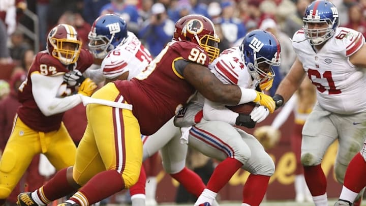 Nov 29, 2015; Landover, MD, USA; Washington Redskins defensive tackle Terrance Knighton (98) tackles New York Giants running back Andre Williams (44) in the first quarter at FedEx Field. Mandatory Credit: Geoff Burke-USA TODAY Sports