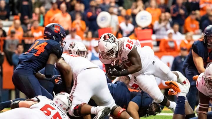 SYRACUSE, NY - OCTOBER 27: Reggie Gallaspy II #25 of the North Carolina State Wolfpack dives in for a touchdown during the fourth quarter against the Syracuse Orange at the Carrier Dome on October 27, 2018 in Syracuse, New York. Syracuse upsets North Carolina State 51-41. (Photo by Brett Carlsen/Getty Images)