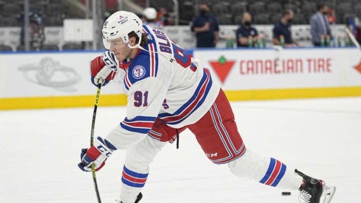 Oct 18, 2021; Toronto, Ontario, CAN; New York Rangers forward Sammy Blais (91) shoots the puck during warm up before a game against the Toronto Maple Leafs at Scotiabank Arena. Mandatory Credit: John E. Sokolowski-USA TODAY Sports