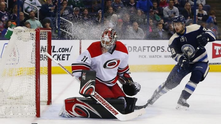 Mar 24, 2016; Columbus, OH, USA; Carolina Hurricanes goalie Eddie Lack (31) makes a save against Columbus Blue Jackets right wing Oliver Bjorkstrand (28) during the second period at Nationwide Arena. Mandatory Credit: Russell LaBounty-USA TODAY Sports
