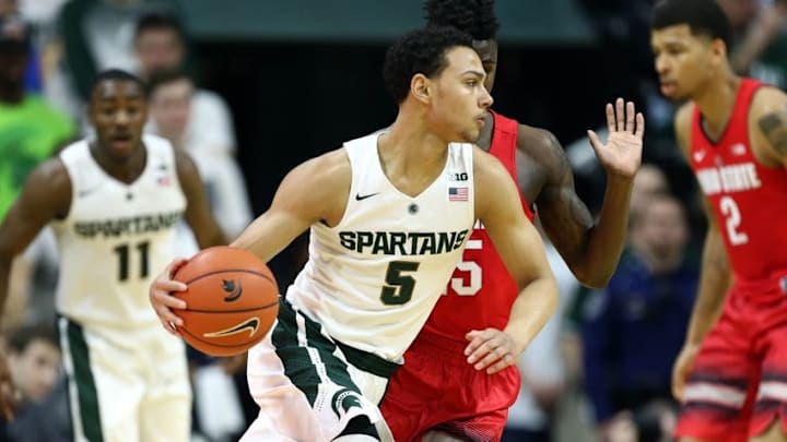 Mar 5, 2016; East Lansing, MI, USA; Michigan State Spartans guard Bryn Forbes (5) dribbles the ball as Ohio State Buckeyes guard Kam Williams (15) defends during the first half at Jack Breslin Student Events Center. Mandatory Credit: Mike Carter-USA TODAY Sports